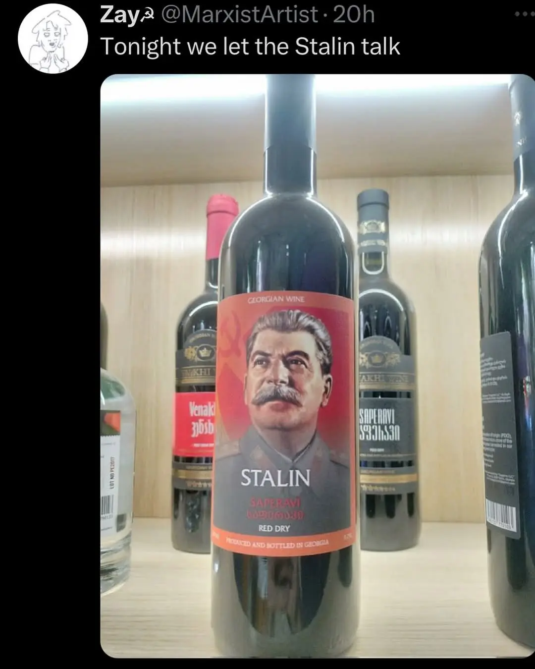 A close-up photo shows a bottle of Georgian wine with a label featuring a portrait of Joseph Stalin, the text 'STALIN' and…