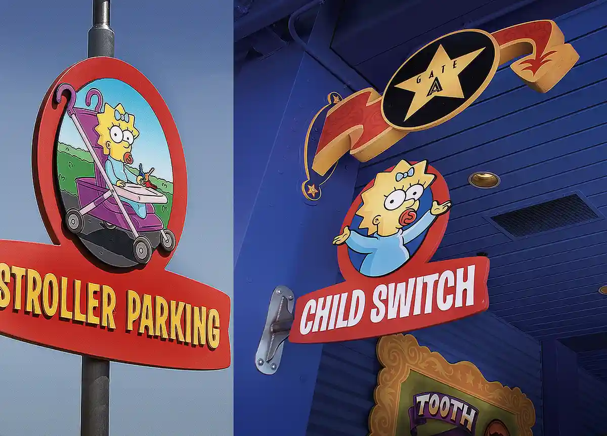 The image displays two adjacent signs featuring the cartoon character Lisa Simpson. The left sign shows Lisa in a stroller…