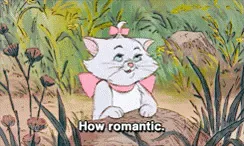 A sequence of six frames shows the animated white cat Marie from Disney's 'The Aristocats' sitting on a rock in a grassy…