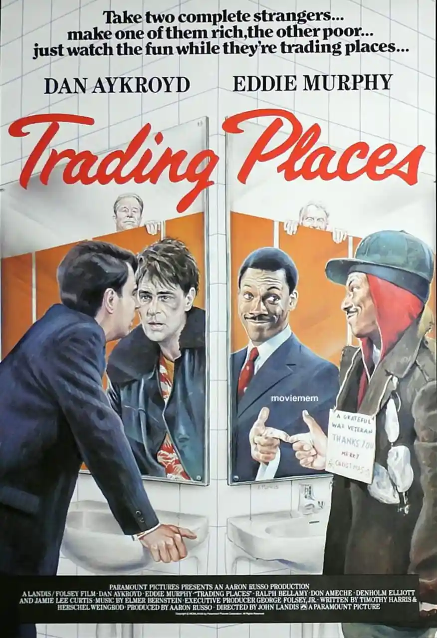 This is a movie poster for 'Trading Places' featuring Dan Aykroyd and Eddie Murphy. The poster depicts two men in a bathroom…