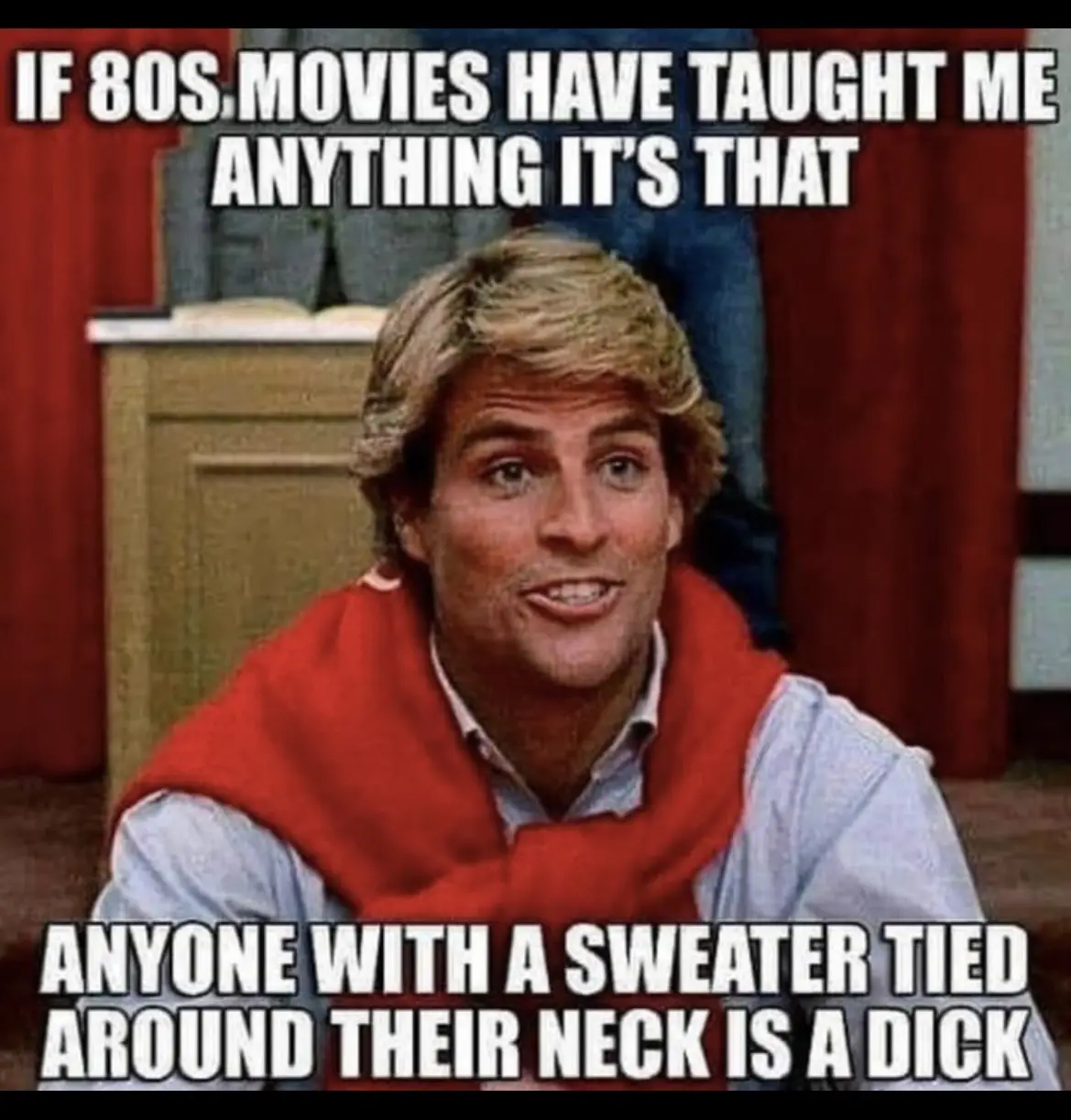 A man with blond hair and a red sweater tied around his neck looks at the camera with a slight smile. The text overlaid on…