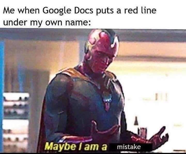 The image shows the character Vision from the Marvel Cinematic Universe, looking downcast and confused with his hands…