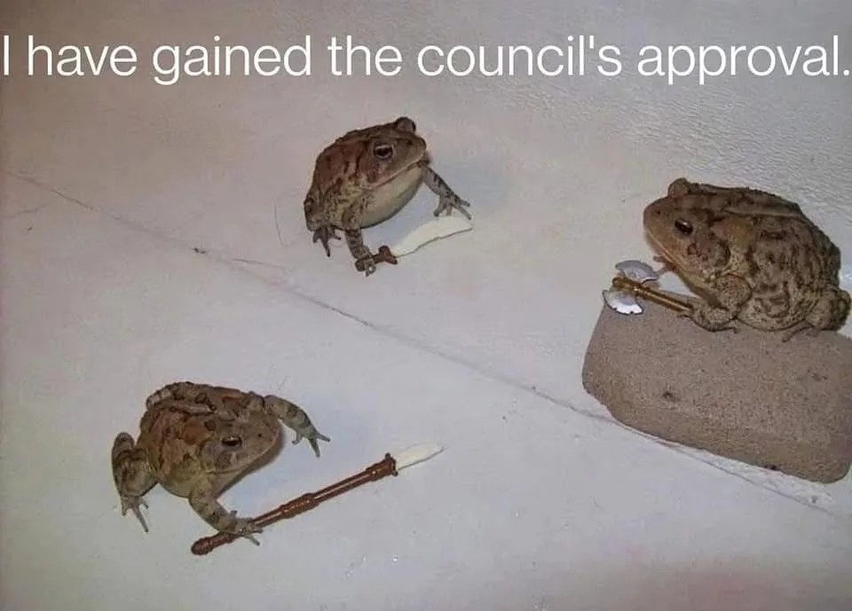 Three toads are depicted on a white wall, each holding a small toy weapon: one holds a sword, another a pickaxe, and the…