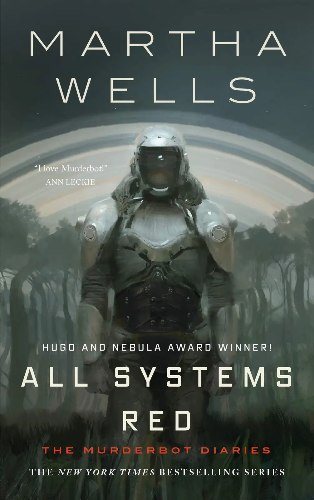 The image is the book cover for 'All Systems Red' by Martha Wells, featuring a humanoid robot in armor standing in a misty…