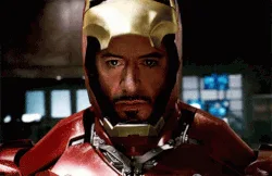 A six-panel sequence shows Iron Man's face transitioning from a human expression to a fully armored, glowing-eyed robotic…