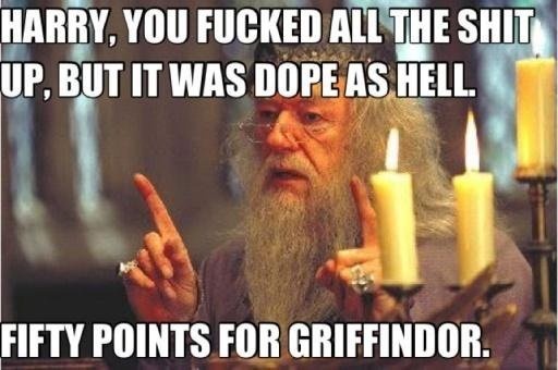 An image of Albus Dumbledore from Harry Potter, with long white beard and glasses, pointing both index fingers forward while…