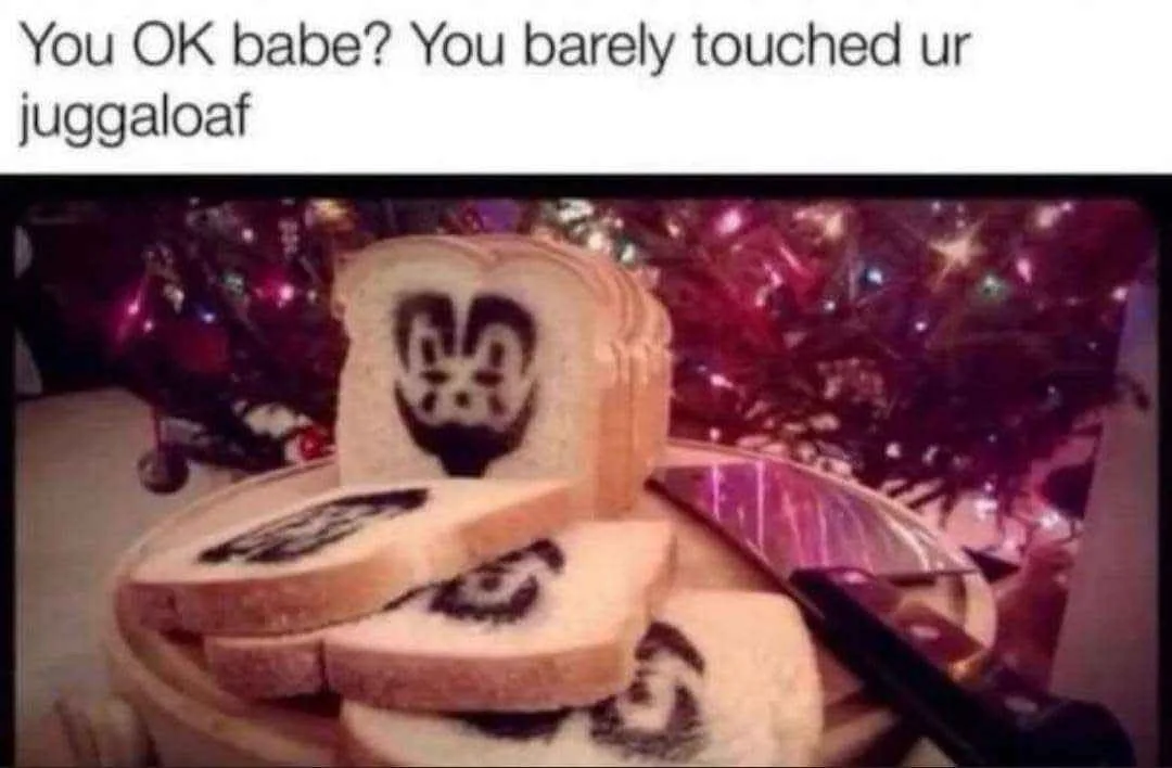 A stack of sliced white bread with a black, stylized face design baked into the center of each slice, resembling the Juggalo…