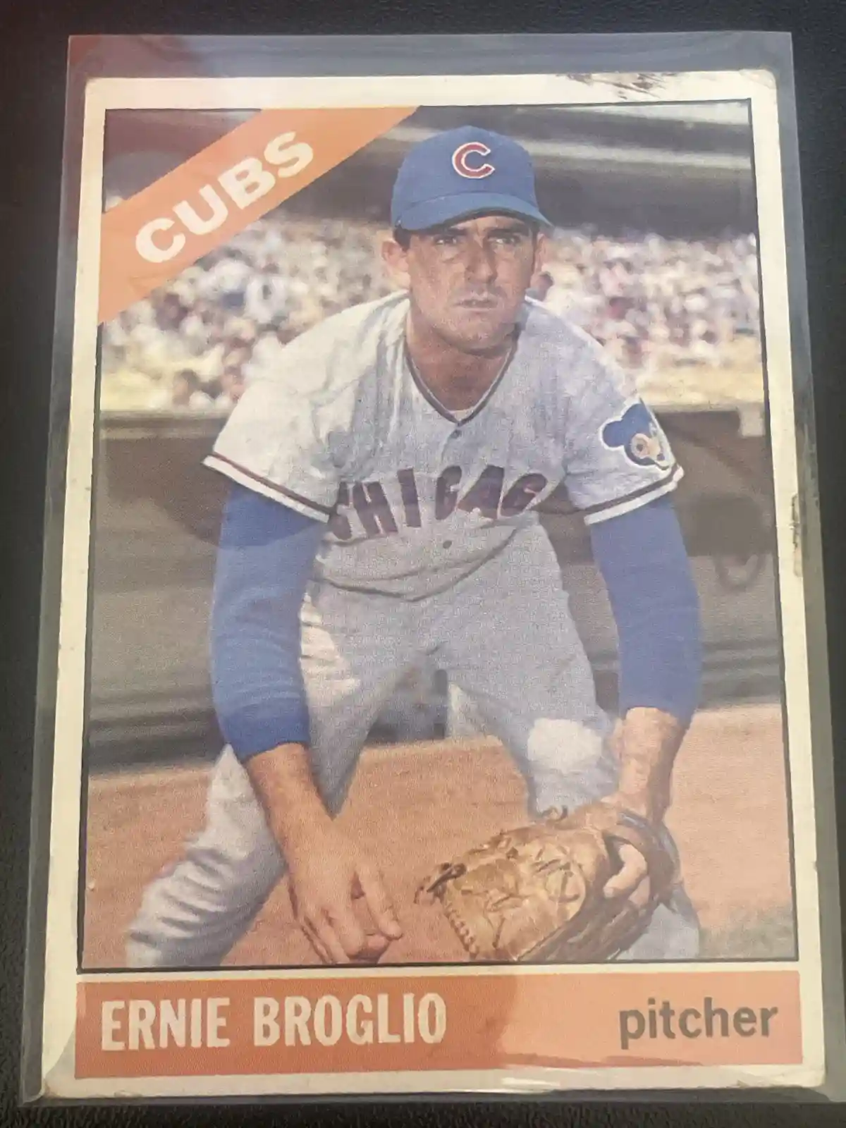 A vintage baseball card of Ernie Broglio, a Chicago Cubs pitcher, wearing a blue cap and grey uniform with 'CHICAGO' across…