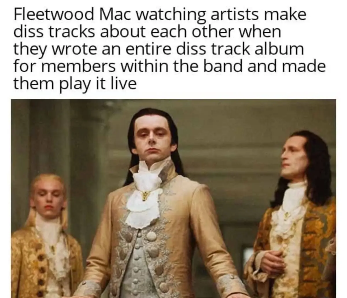 Three men in ornate 18th-century aristocratic costumes stand in a formal setting, with the central figure looking down with…