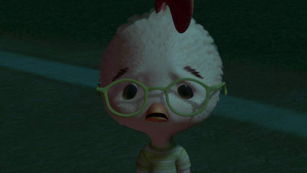 A close-up of a cartoon chicken with fluffy white feathers, green-rimmed glasses, and a red comb, wearing a striped shirt…