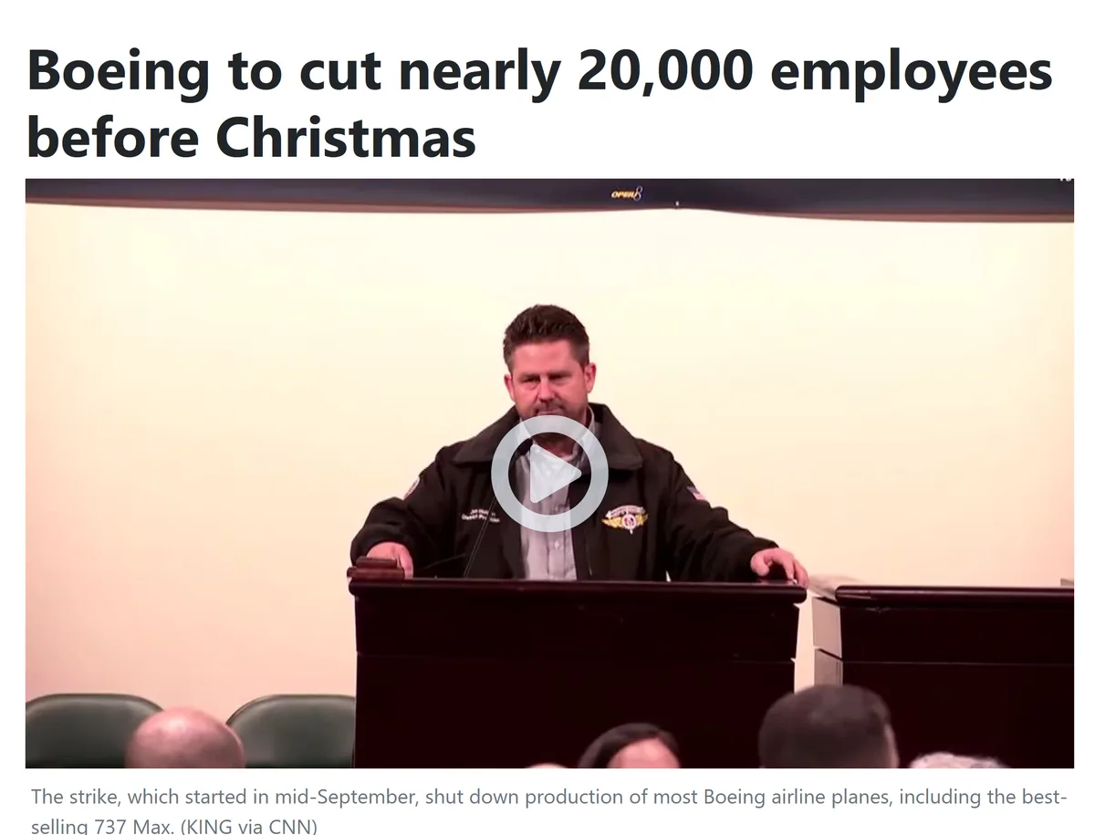 A man in a black jacket stands at a podium in front of an audience, with a video play button overlay. The headline text…