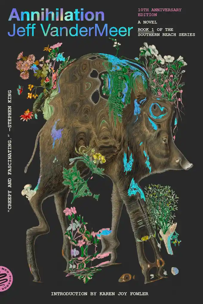 The image is the cover of Jeff VanderMeer's novel 'Annihilation,' featuring a surreal, wood-textured boar-like creature with…
