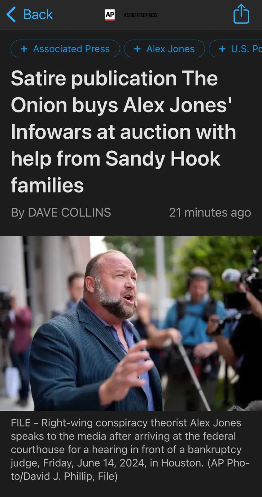 The image displays a screenshot of an Associated Press news article headline that reads 'Satire publication The Onion buys…