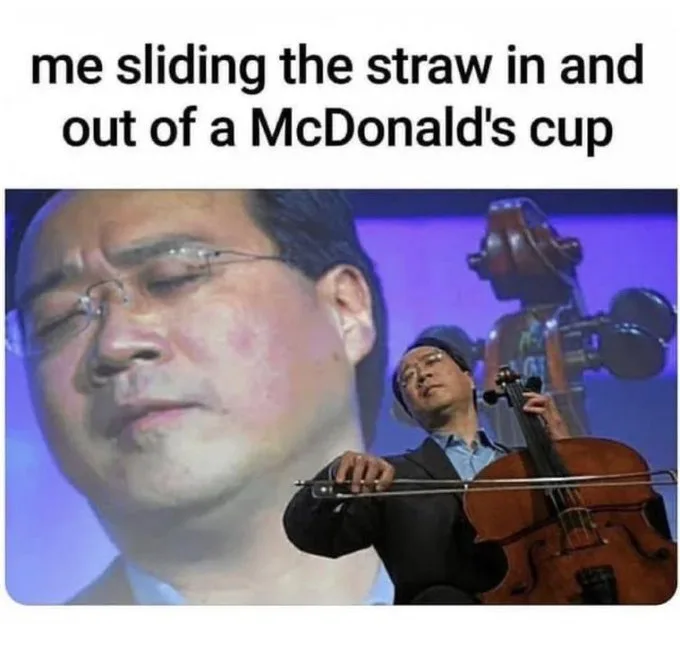 A man with glasses is shown in a close-up, looking serene and focused, while a cellist plays in the background. The overlaid…