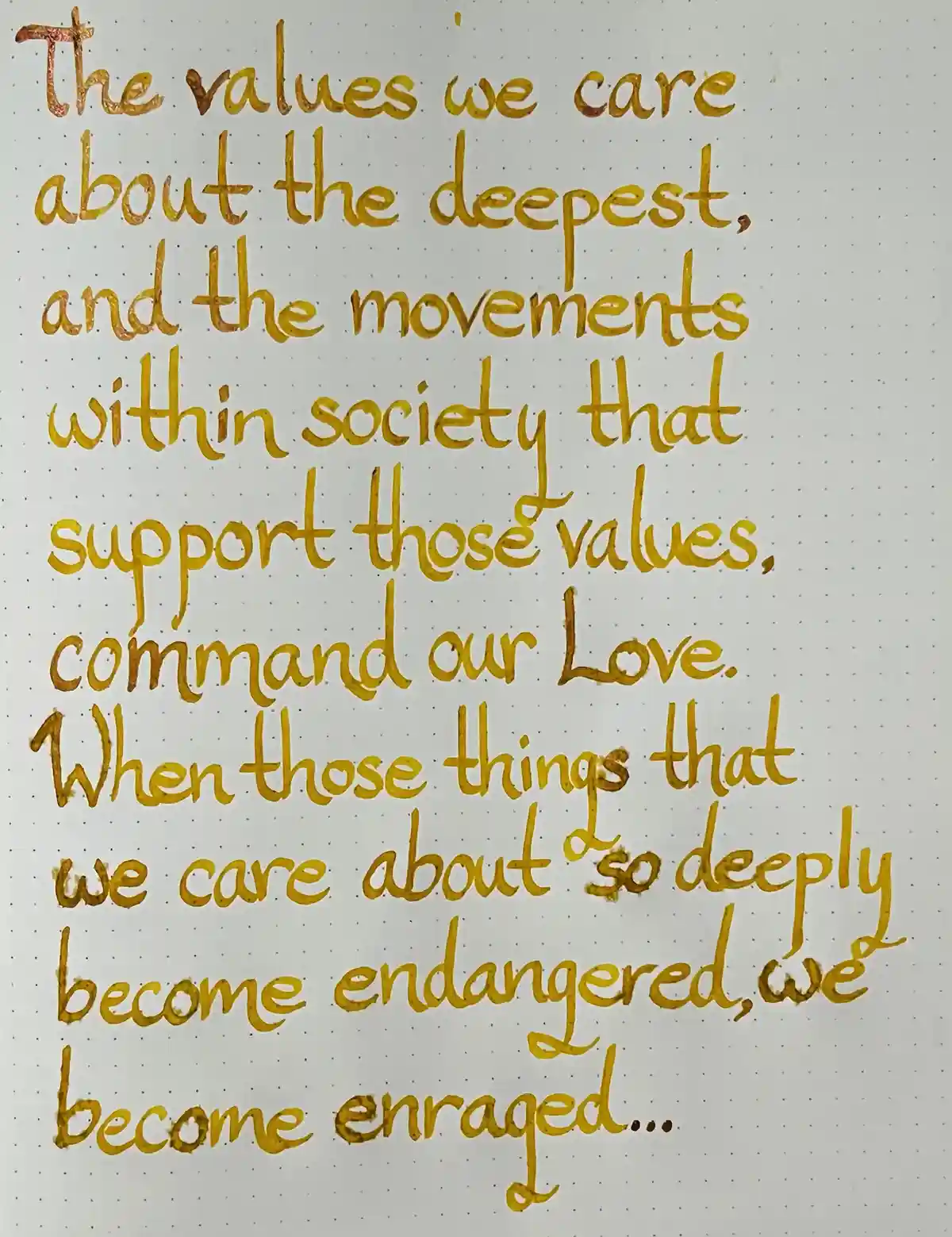 A handwritten quote in gold ink on dotted paper reads: 'The values we care about the deepest, and the movements within…
