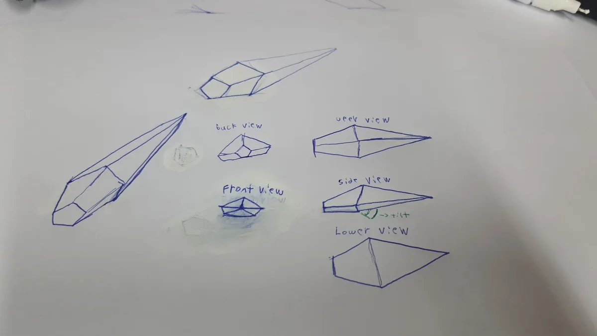 A white paper displays multiple hand-drawn blue ink sketches of a geometric, pointed object from various angles, labeled…