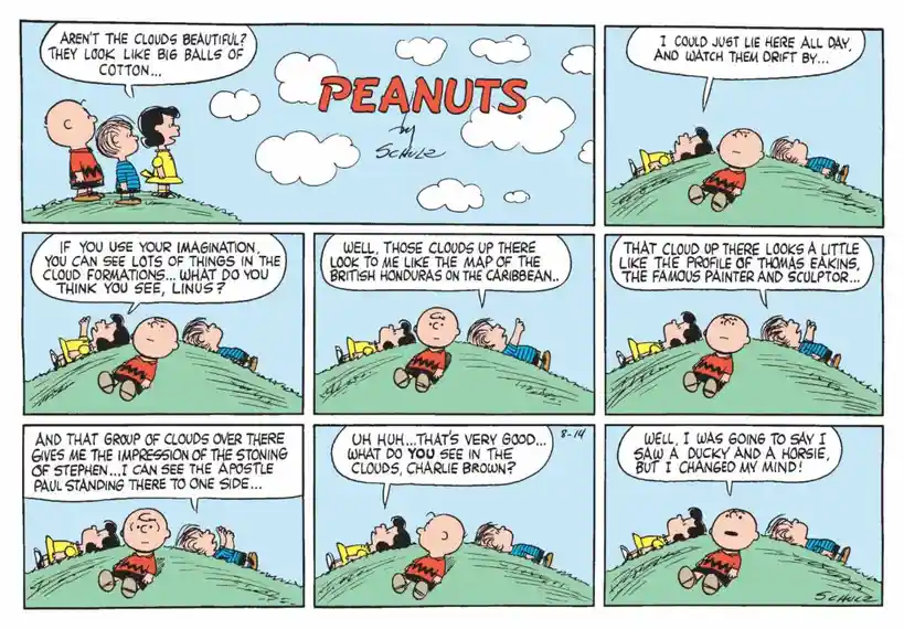 A six-panel Peanuts comic strip shows Charlie Brown, Linus, and Lucy lying on a grassy hill watching clouds. Linus imagines…