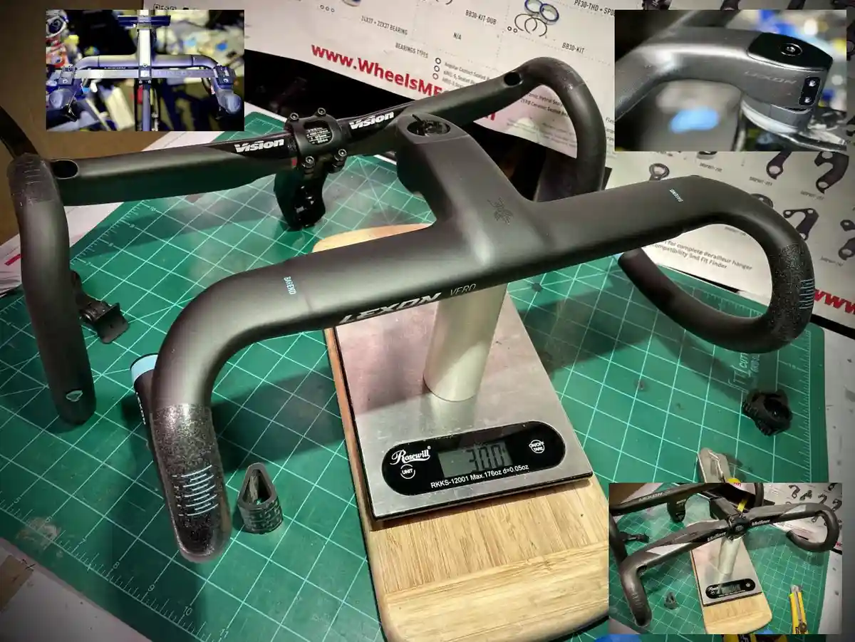 A black Lexon Vero bicycle handlebar is placed on a digital kitchen scale that reads '300', likely in grams, on a green…