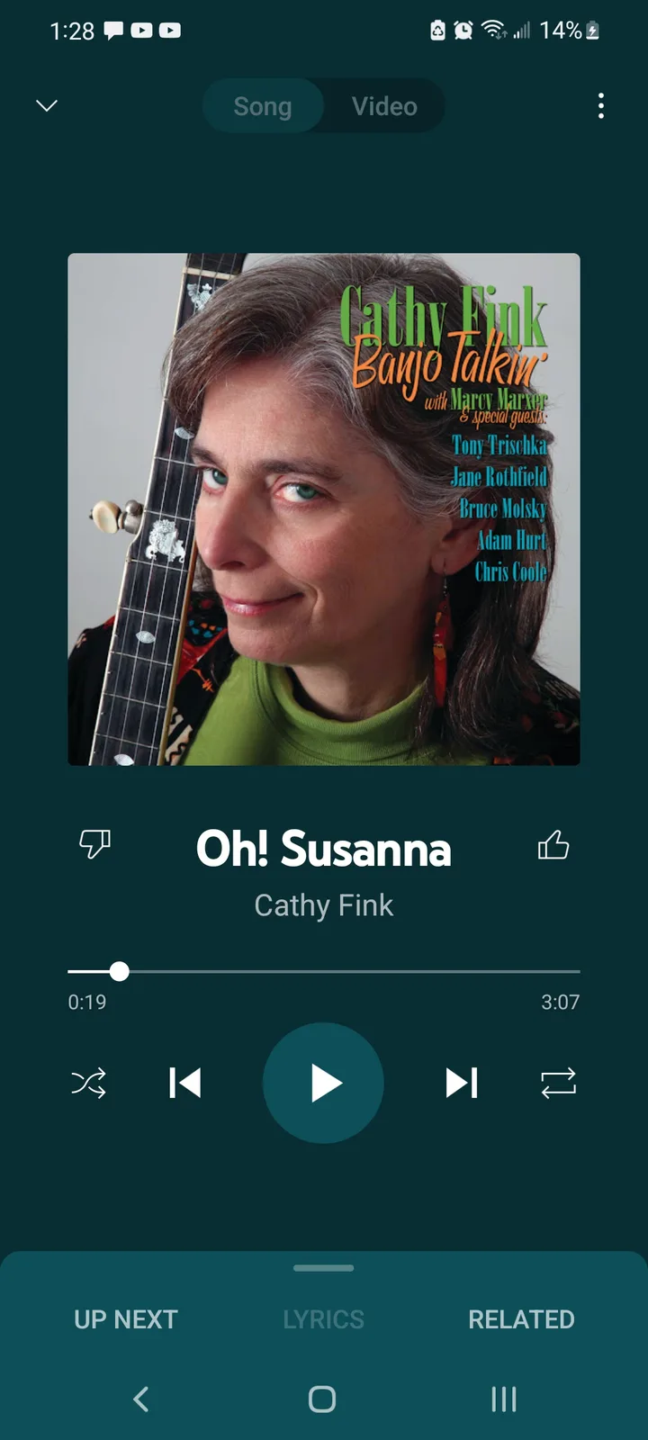 A screenshot of a music player app showing the song 'Oh! Susanna' by Cathy Fink, with the album art featuring Cathy Fink…