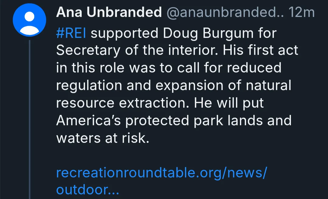 A screenshot of a tweet from Ana Unbranded (@anaunbranded) posted 12 minutes ago, criticizing REI for supporting Doug Burgum…