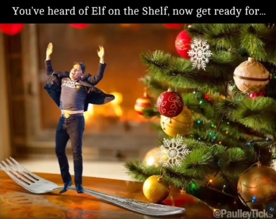 A man in casual clothes stands on a giant fork next to a decorated Christmas tree, arms raised in excitement. The text at…