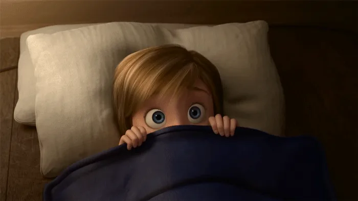 A six-panel image shows a young animated boy in bed, peeking out from under a dark blue blanket with wide, fearful eyes. The…