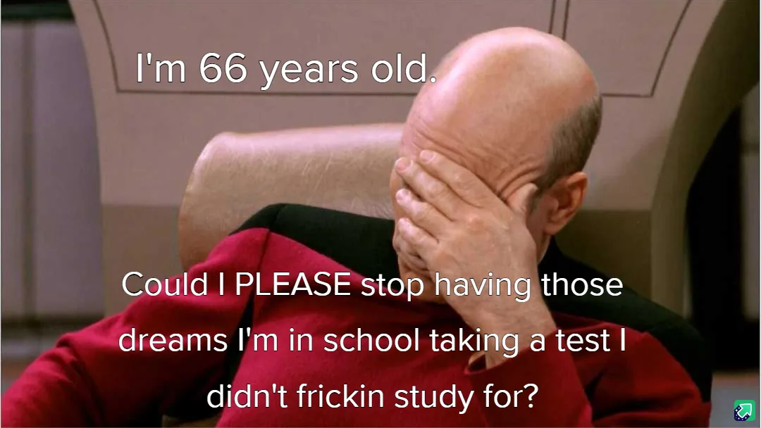 A bald man in a red uniform sits in a chair, covering his face with his hand in a gesture of frustration or embarrassment…