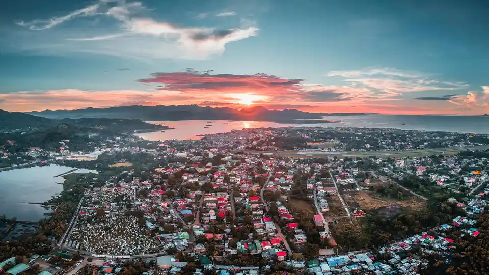 A kaleidoscope of warm hues unfurls as day yields to nightfall, casting a golden glow over Masbate City's undulating…