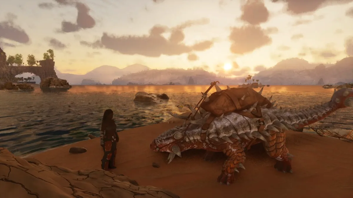 A video game screenshot shows a female character standing on a beach next to a large, spiky, armored dragon-like creature at…