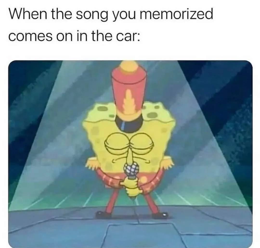 SpongeBob SquarePants is shown wearing a red top hat and holding a microphone, standing on a stage under a spotlight with a…