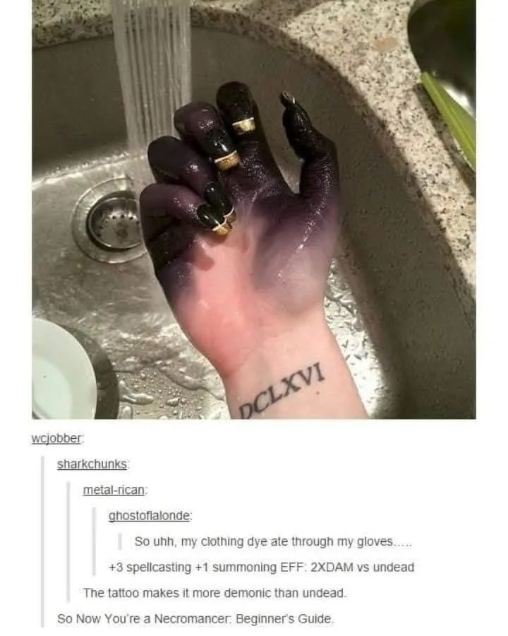 A hand with black and gold nail polish is under a running faucet in a kitchen sink, stained with purple dye. The wrist has a…