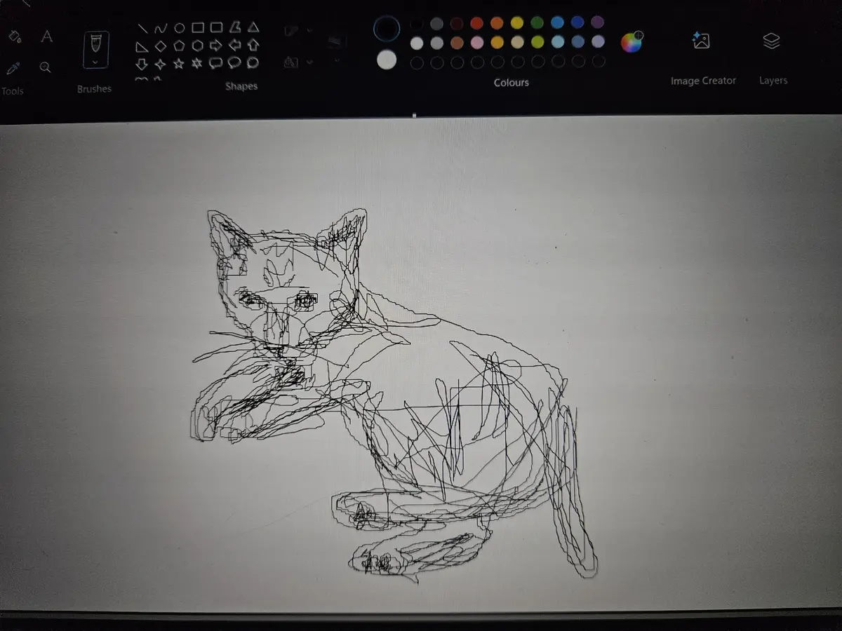 A messy, scribbled line drawing of a cat is shown on a digital drawing application's canvas, with the toolbar visible at the…