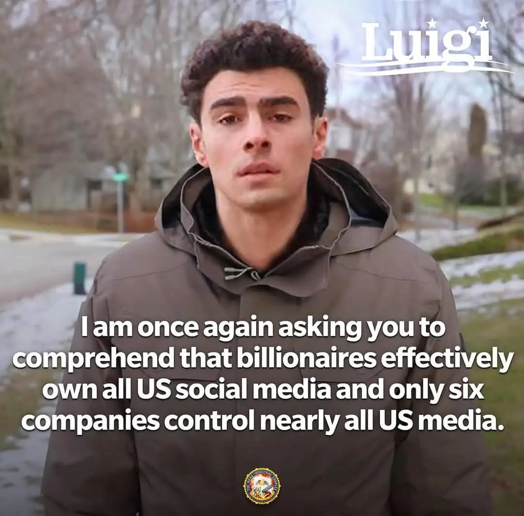 A young man with curly hair wearing a brown hooded jacket stands outdoors in a snowy residential area. The image has text…