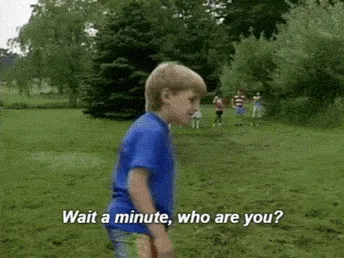 A six-panel image sequence shows a young boy in a blue shirt standing in a grassy field with trees, turning to face the…