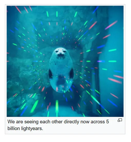 A seal is shown swimming underwater in an aquarium, with colorful laser beams radiating outward from its body, creating a…