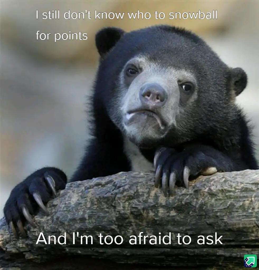 A close-up photo of a sad-looking spectacled bear resting its paws on a log, with white text overlaid at the top and bottom…