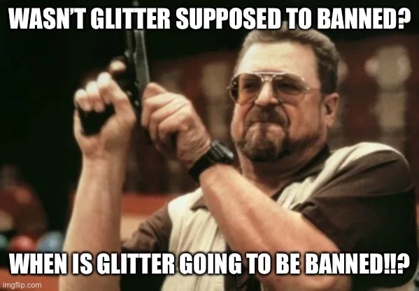 A man with a mustache and aviator sunglasses holds a handgun with both hands, pointing it upward. The image has white text…
