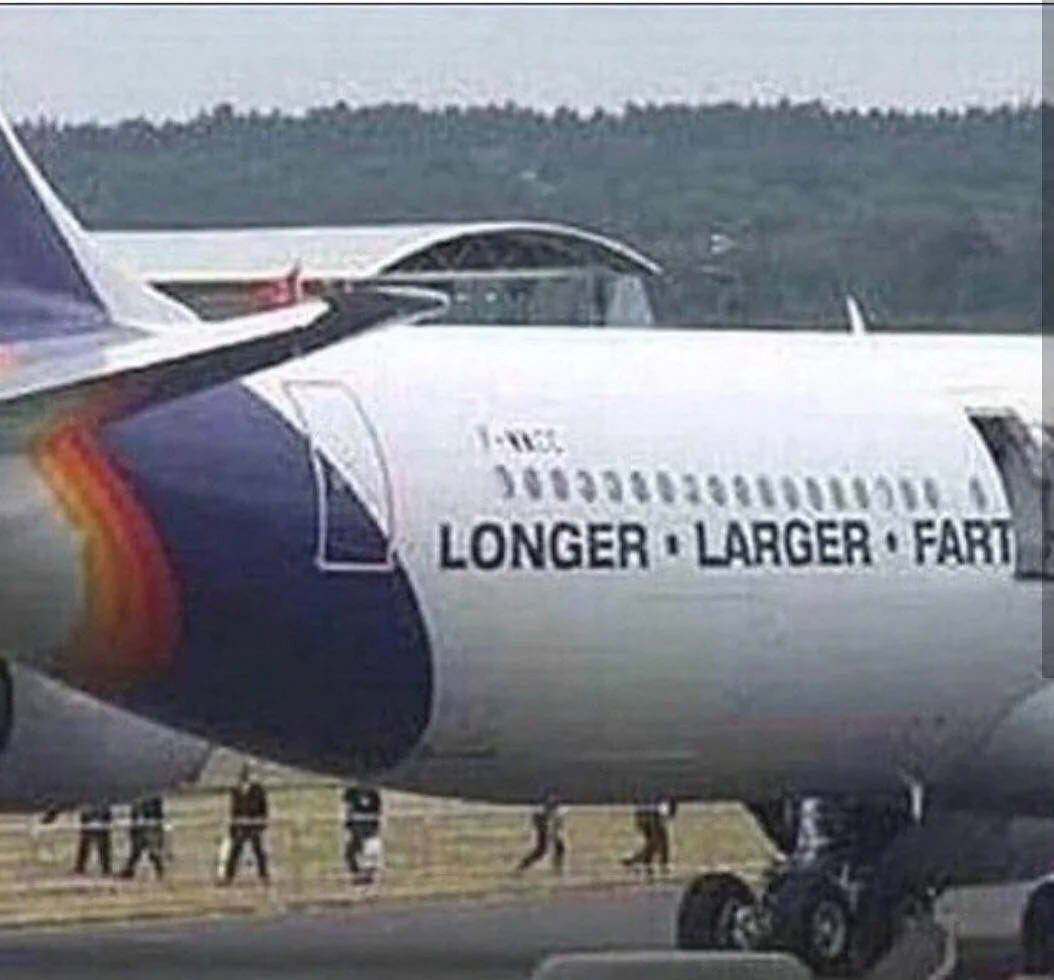 A close-up of an airplane fuselage with the text 'LONGER • LARGER • FART' overlaid in bold black letters. The aircraft has a…