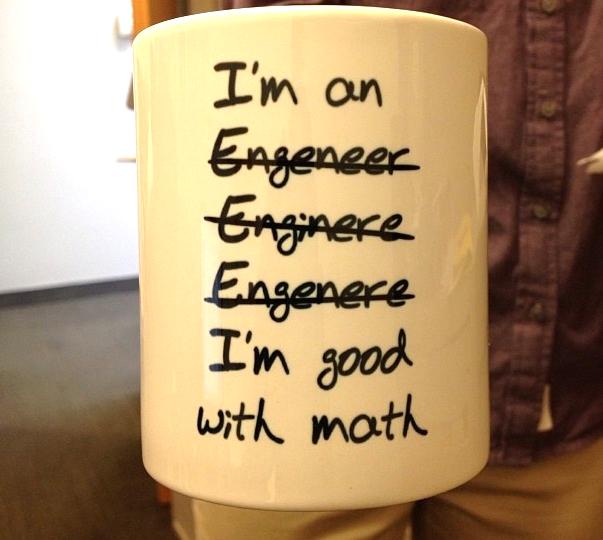 A white ceramic mug held by a person wearing a brown shirt, with handwritten text that reads 'I'm an Engineer', followed by…