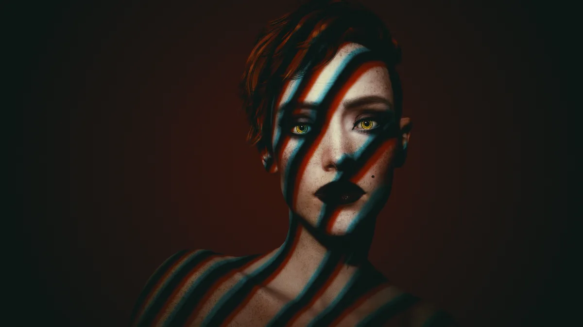 A person with short hair and freckles stares directly at the camera, their face and shoulders covered in diagonal red and…