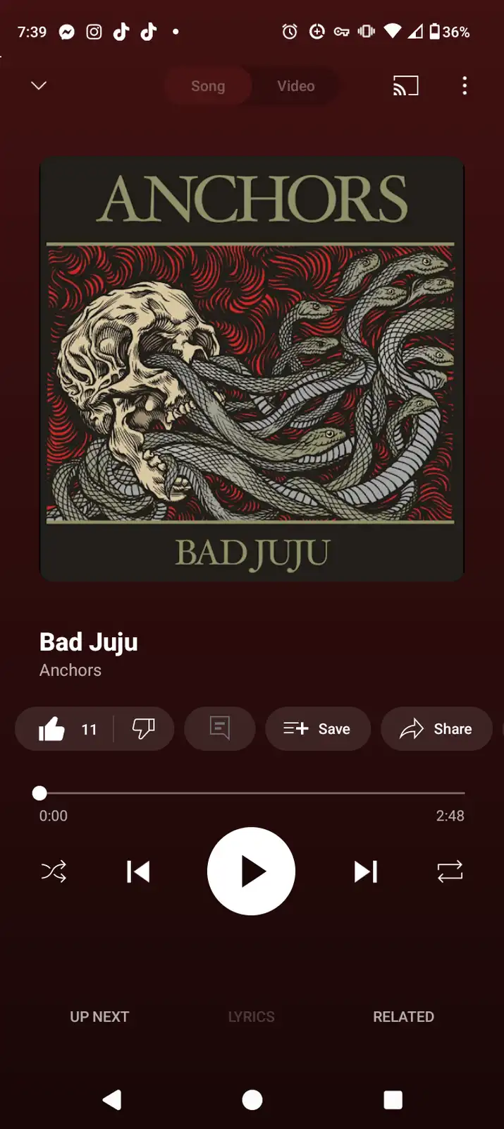A smartphone music player screen shows the song 'Bad Juju' by Anchors, with the album art featuring a skull entangled in…