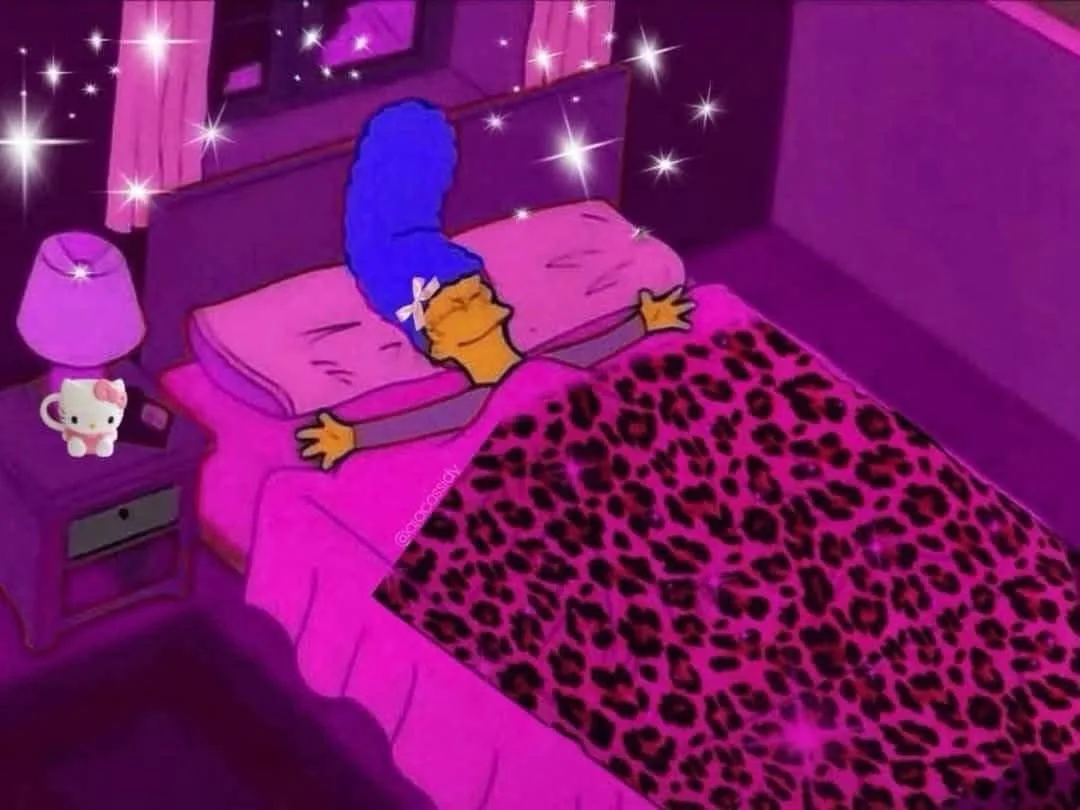 Marge Simpson is shown sleeping peacefully in a bed with a leopard print blanket, surrounded by sparkles, in a room with…