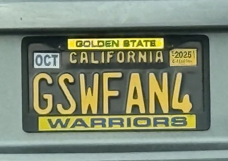 A close-up of a California license plate with the text 'GOLDEN STATE CALIFORNIA' at the top and 'WARRIORS' at the bottom…