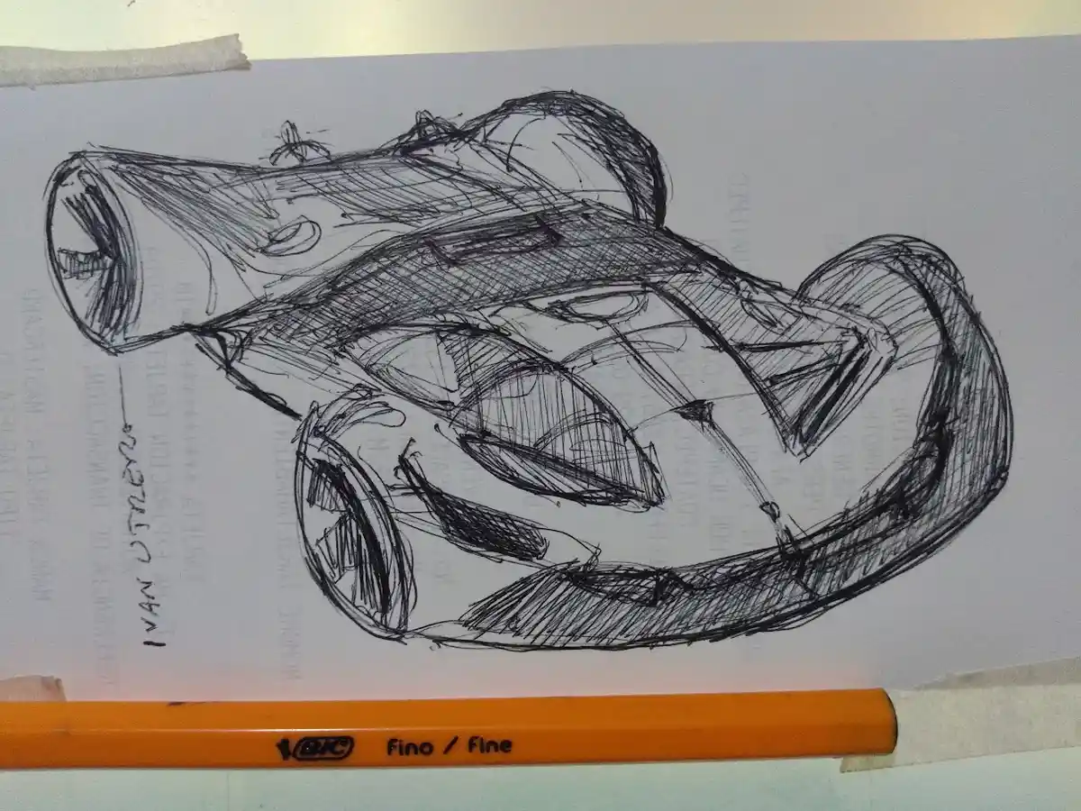 A rough, scribbled pencil sketch of a futuristic-looking car on paper, with an orange BIC 'fino/fine' pencil lying…