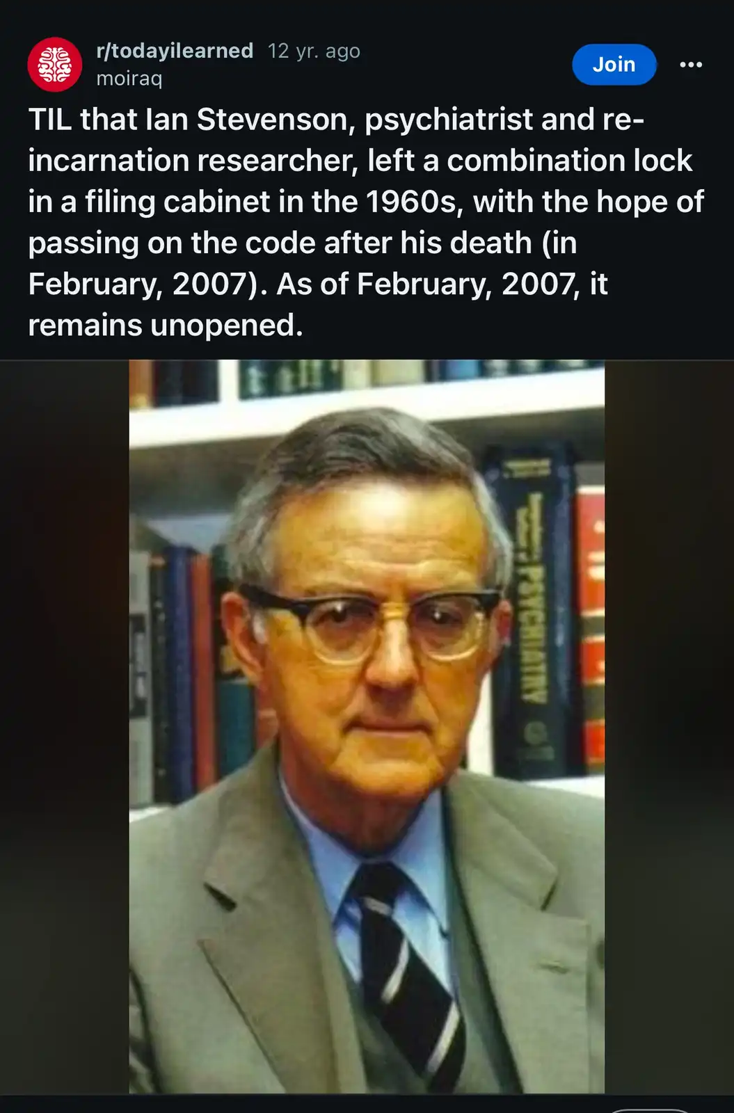A photograph of Ian Stevenson, a man with glasses and a suit, standing in front of bookshelves. The overlaid text explains…