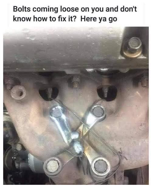 A close-up photo of a mechanical engine part with several bolts, some of which are visibly loose or missing. Two wrenches…