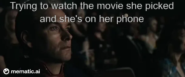 A man with a disappointed expression sits in a dark theater, looking off to the side. The overlaid text reads 'Trying to…