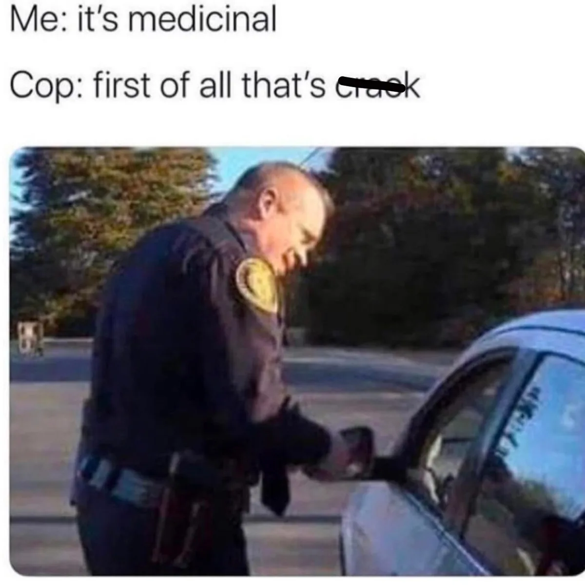 A police officer in uniform is leaning toward a car window, appearing to speak to a driver. The image has text overlaid at…