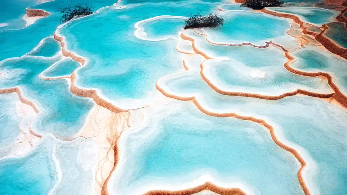 Huanglong, a striking World Heritage Site, is a travertine terrace system with nearly 700 pools featuring countless colors…