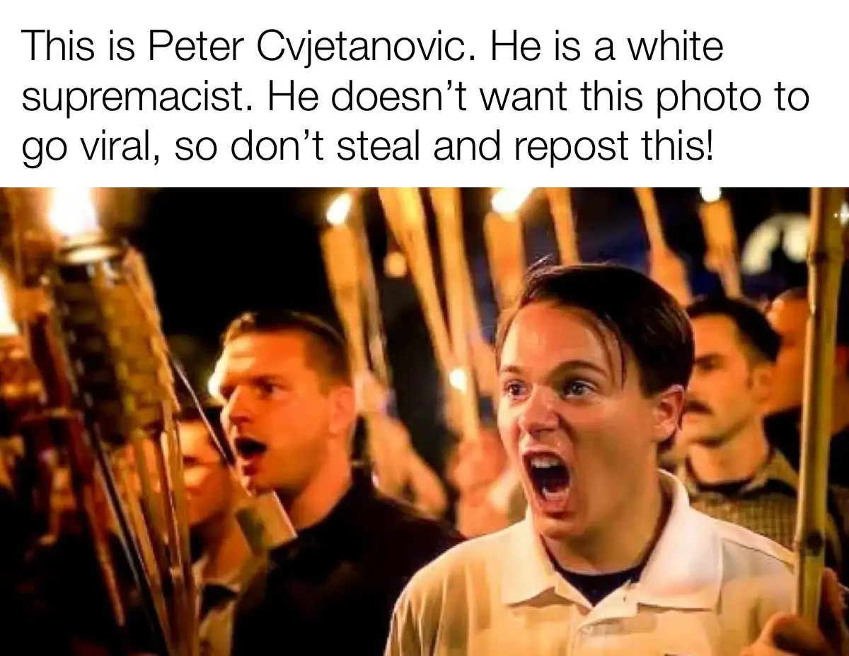 A photo shows a man in a white polo shirt shouting with his mouth open, holding a torch, surrounded by other men also…